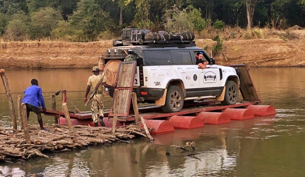 Kingsley Holgate Foundation team taking a vehicle across a river