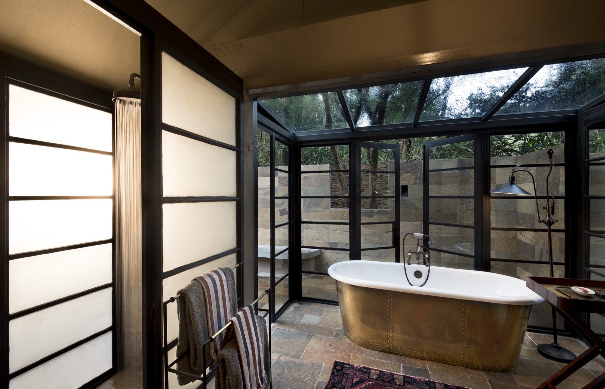 Copper bathtub inside a Luxury Tent at &Beyond Bateleur Camp
