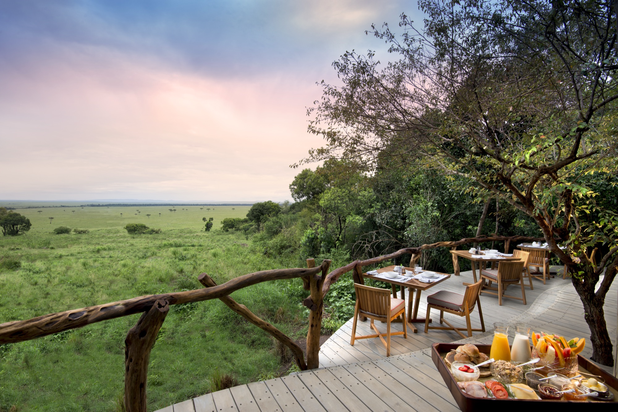 Lunch table set on the North Camp deck at &Beyond Bateleur Camp overlooking the plains